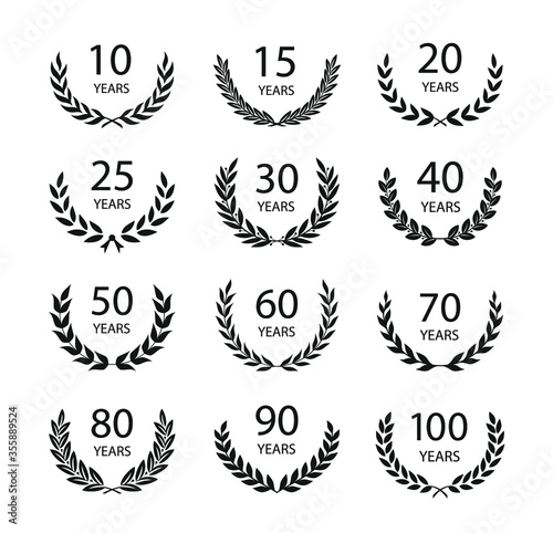 Set of anniversary laurel wreaths. Black and white anniversary symbols isolated on black background. 10, 15, 20, 25, 30,40,50,60,70,80,90, 100 years. Template for award and congratulation design. 