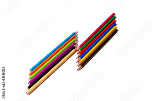 A set of colored pencils lies horizontally on an isolated white background. Isolate photo