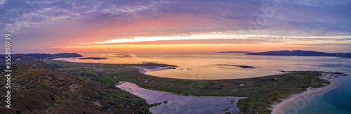 Aerial of sunset above Clooney  Narin and Portnoo in County Donegal - Ireland.