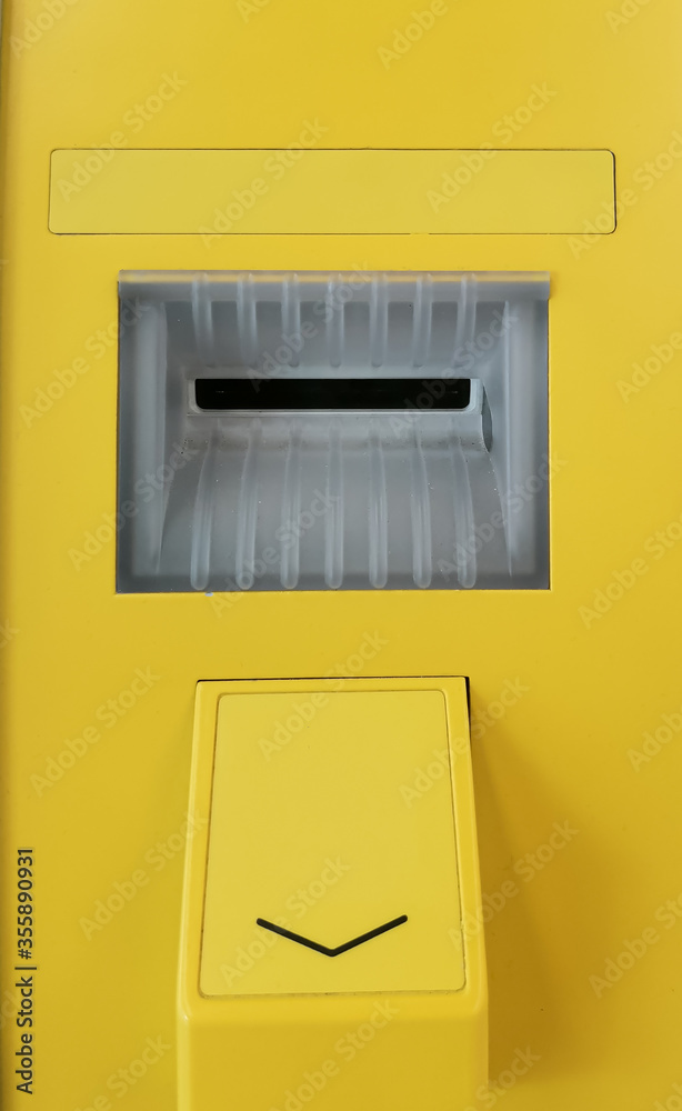 Secure card reader in a yellow public ATM. Safe use of bank cards, the fight against financial fraud. Secure card reader in a yellow public ATM. Safe use of bank cards, the fight against financial fraud.