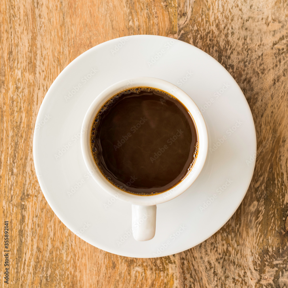 Cup of coffee on wooden background. Top view. Cup of coffee on wooden background. Top view.
