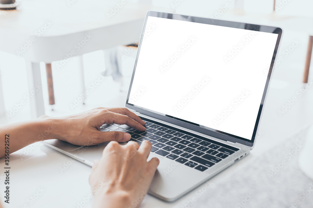 computer mockup image blank screen.hand woman work using laptop with white background for advertising,contact business search information on desk at coffee shop.marketing and creative design