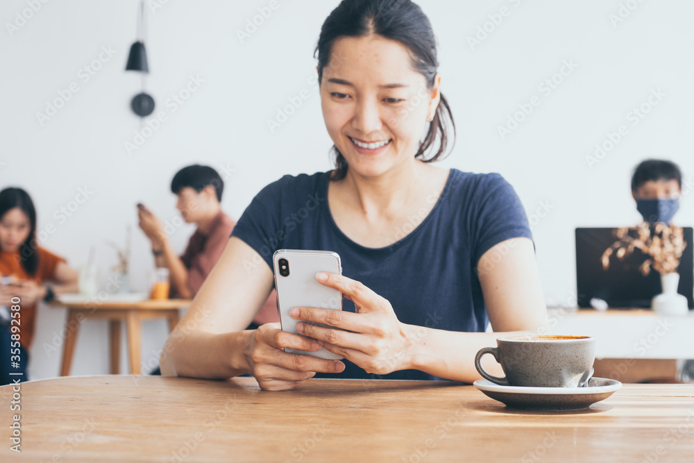 using cell phone.hand woman holding texting message on screen mobile chatting,search internet information sitting in office.technology device contact communication connecting people concept using cell phone.hand woman holding texting message on screen mobile chatting,search internet information sitting in office.technology device contact communication connecting people concept