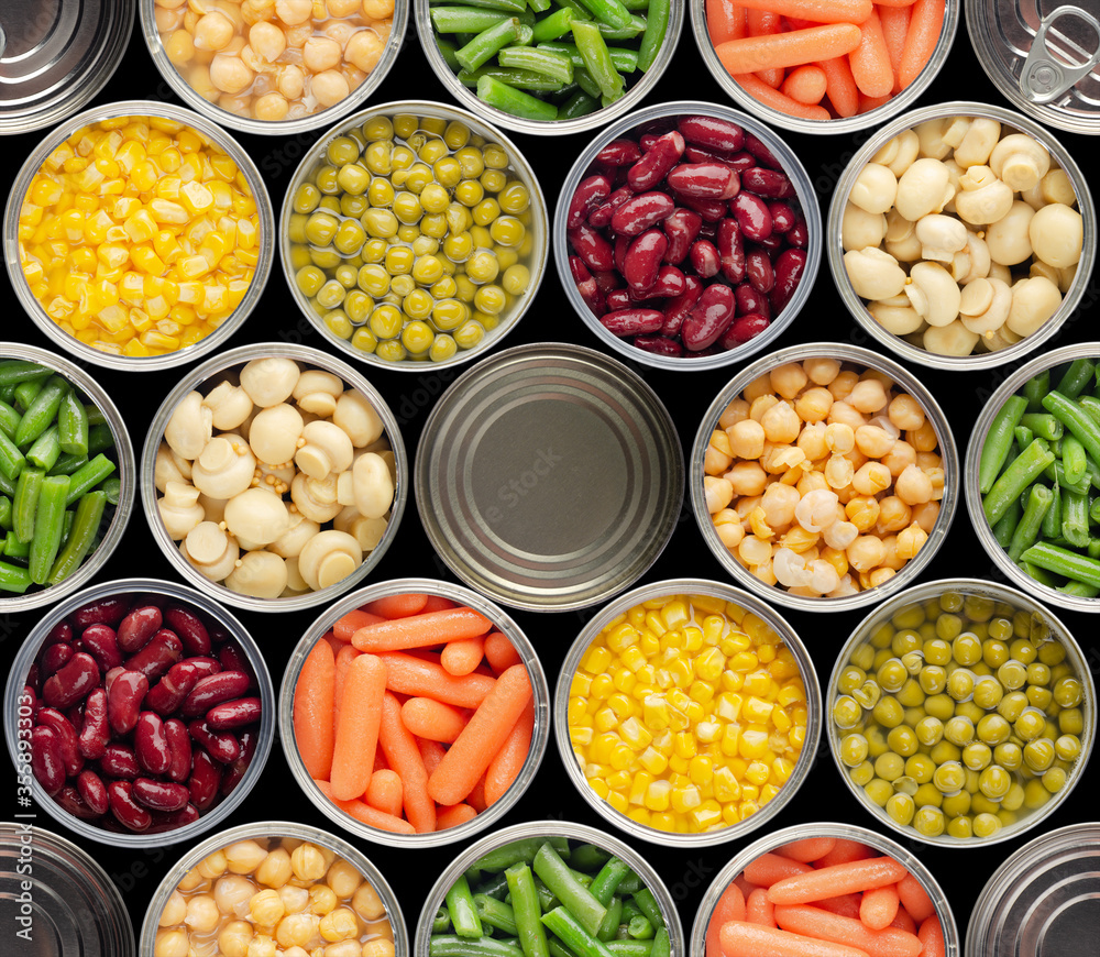 Fototapeta Seamless food background made of opened canned chickpeas, green sprouts, carrots, corn, peas, beans and mushrooms on black background