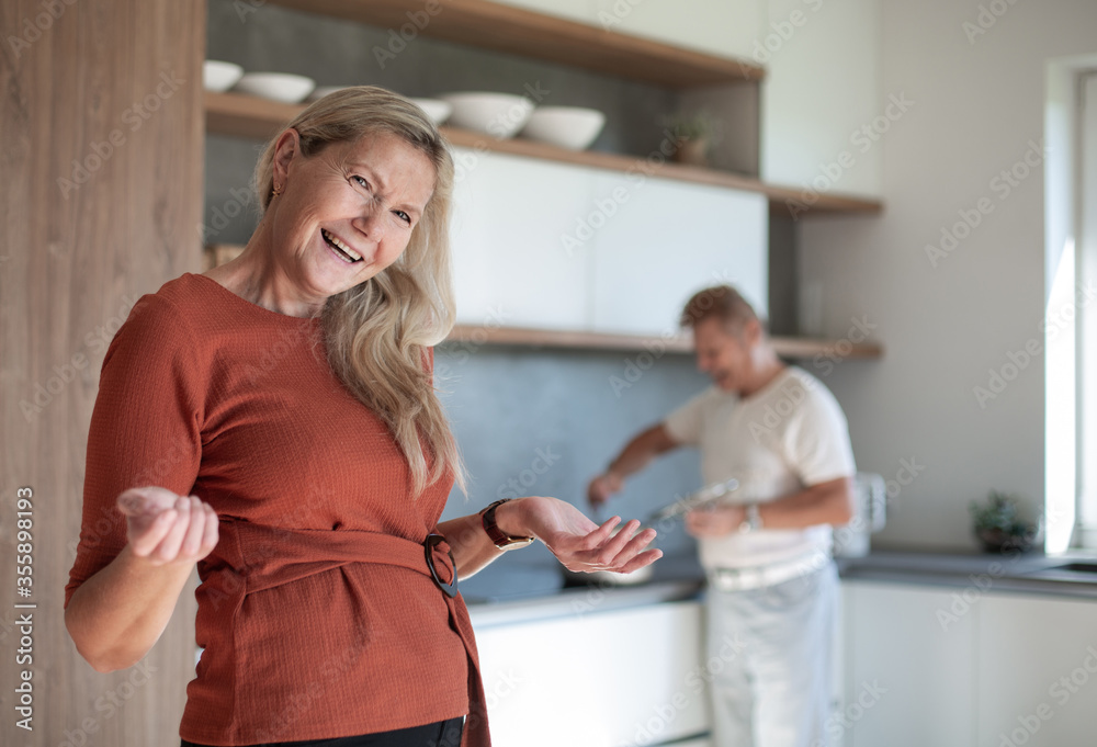 friendly sweet woman inviting to her kitchen . friendly sweet woman inviting to her kitchen .