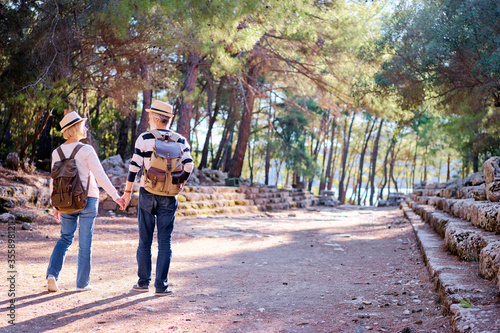 Travel and tourism. Senior family couple walking together on ancient sighseeing.