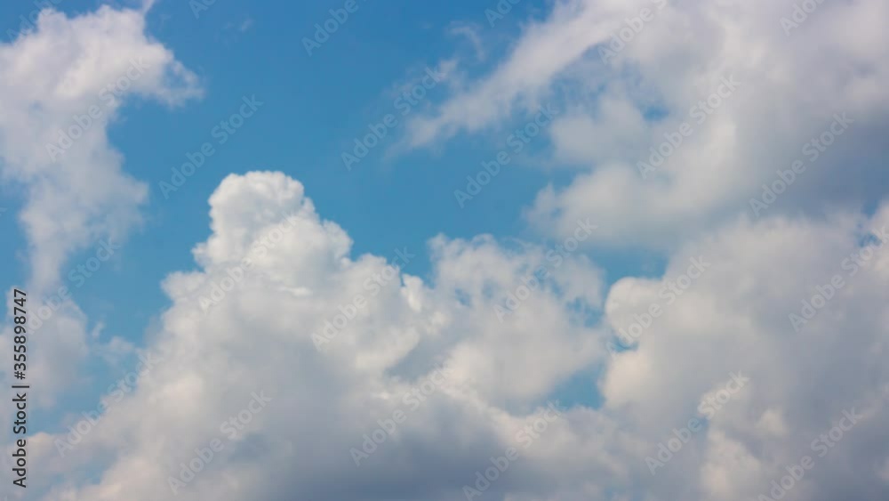 Swirling white clouds loop timelapse on blue sky Swirling white clouds loop timelapse on blue sky