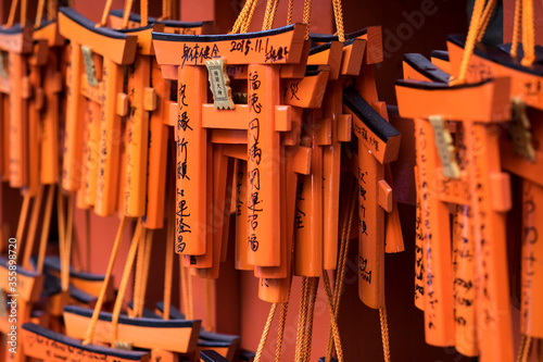 Closeup of Small Torii gates with peoples wishes at Fushimi Inari shrine, Kyoto. Normally Torii is the gate way at the entrance to the Shinto Shrine in Japan