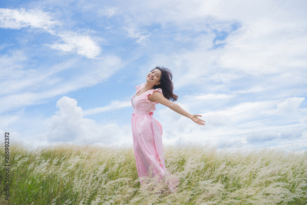 Beautiful asian woman She is having freedom. She jumps on the meadow. Beautiful asian woman She is having freedom. She jumps on the meadow.