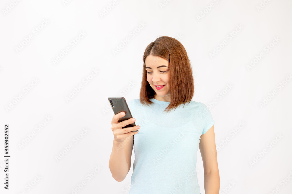 Happy business woman with a cell phone. Isolated on white background. Happy business woman with a cell phone. Isolated on white background.