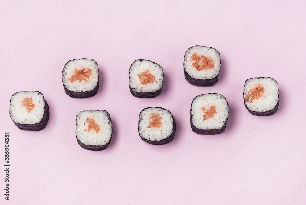 Fresh Made Sushi set with Salmon on Pink Background Japanese Food Sushi Top View Horizontal Fresh Made Sushi set with Salmon on Pink Background Japanese Food Sushi Top View Horizontal