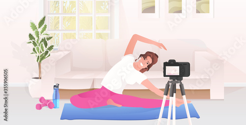 woman fitness trainer recording video blog using camera on tripod live streaming social media network blogging workout concept living room interior horizontal full length vector illustration