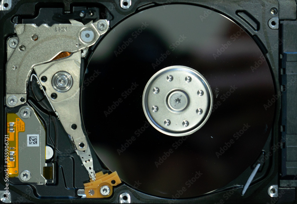 Disassembled hard drive from the computer Disassembled hard drive from the computer