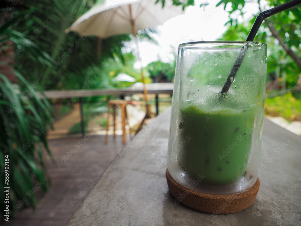 The cup is placed on the table and there is a beautiful nature around in Thailand. The cup is placed on the table and there is a beautiful nature around in Thailand.
