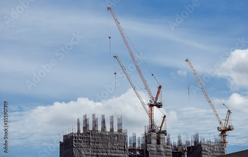 Construction of a new building using a crane.
