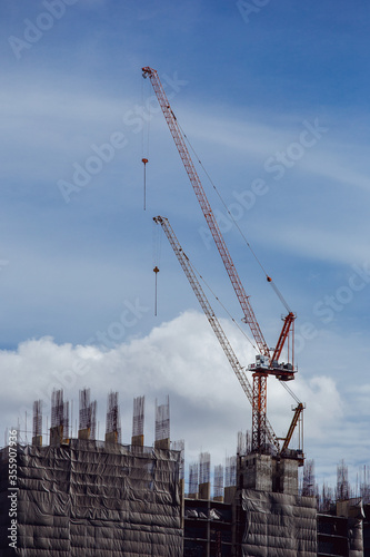 Construction of a new building using a crane.