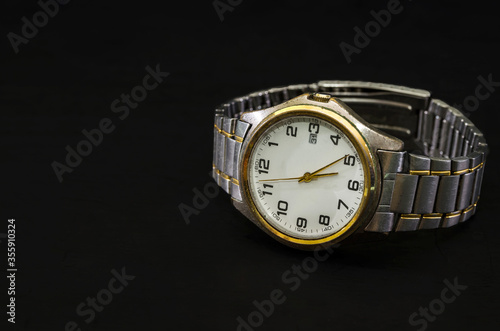 men's wristwatch isolated on a black background. Copy of space. Place for text.