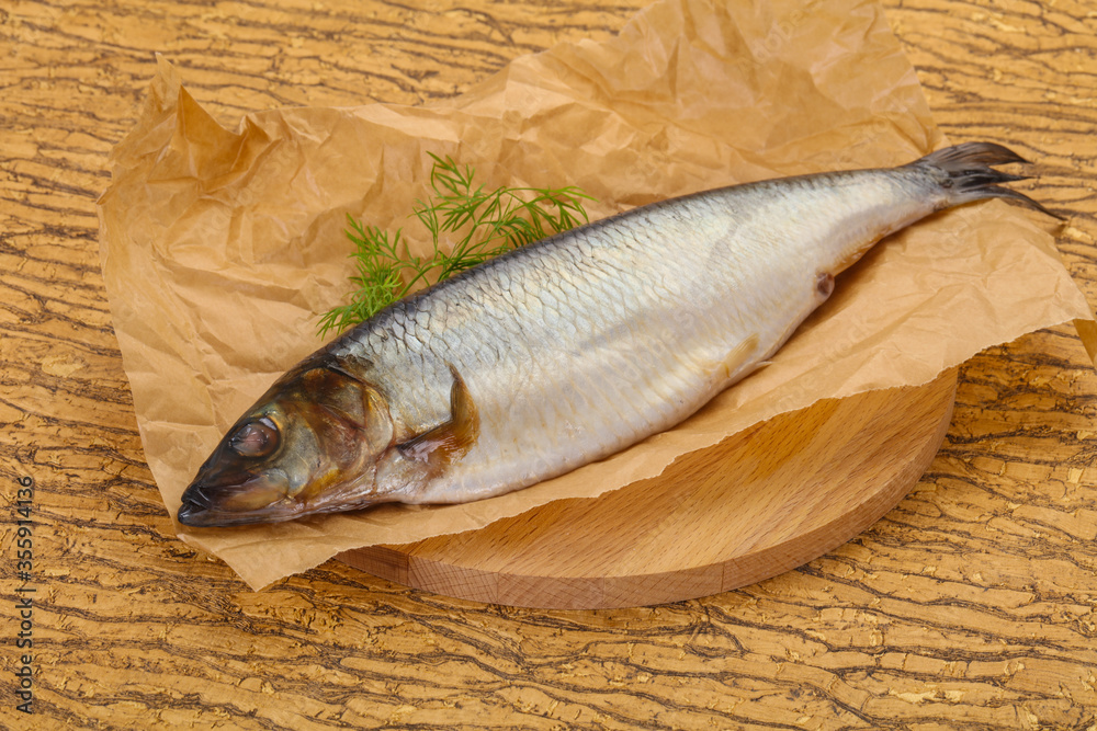 Salted herring over the wooden board