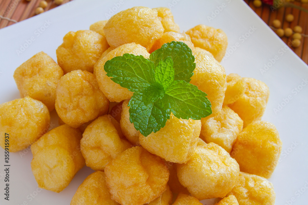 Deep-fried tofu puffs, tofu cubes close up Deep-fried tofu puffs, tofu cubes close up