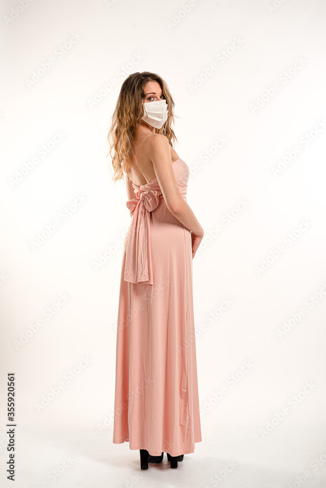 Woman wearing surgical mask on a white background Woman wearing surgical mask on a white background