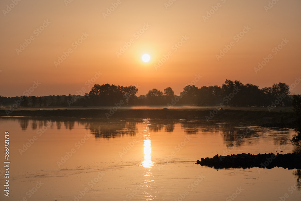 Naklejka premium sunrise over the river