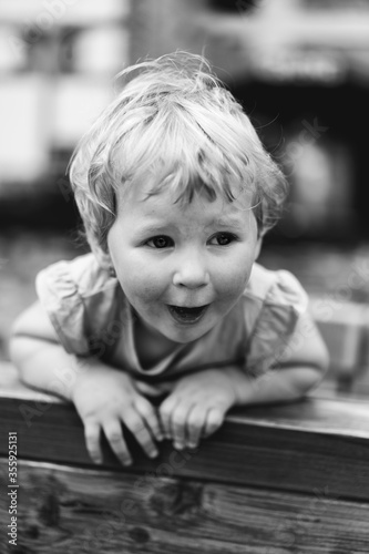 Black and white portrait of smiling little girl