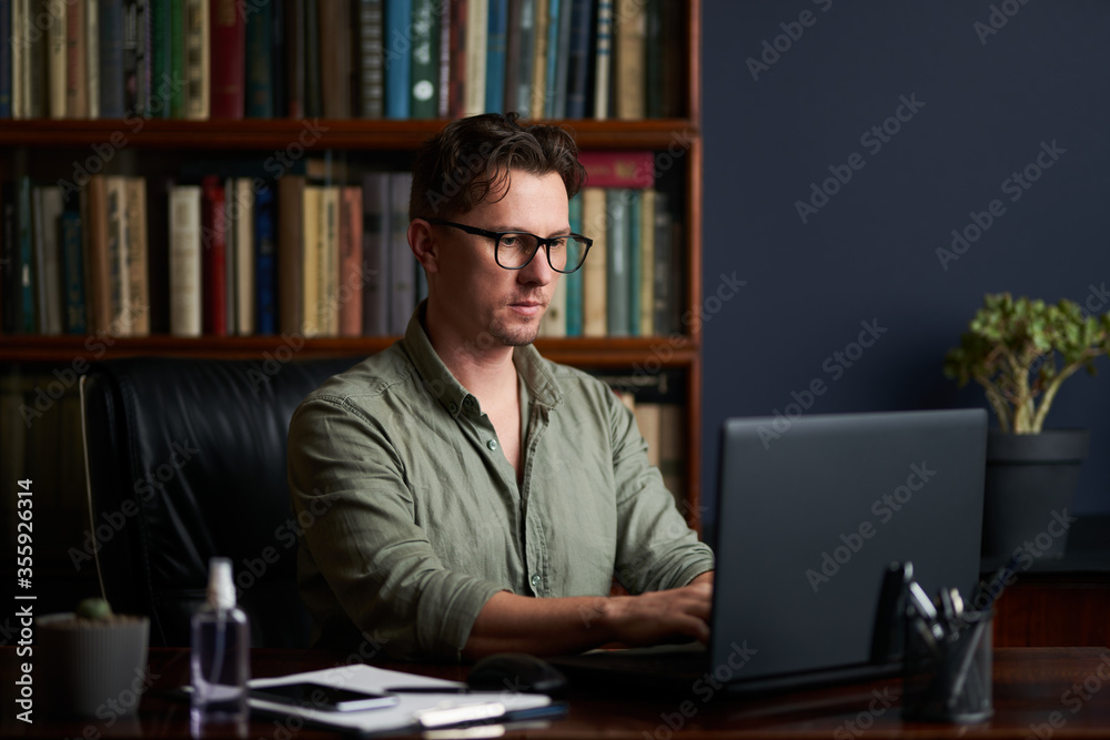 Handsome man working at his workplace. Work from home. Handsome man working at his workplace. Work from home.