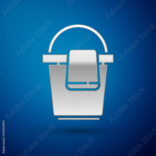 Silver Bucket with rag icon isolated on blue background. Cleaning service concept. Vector Illustration