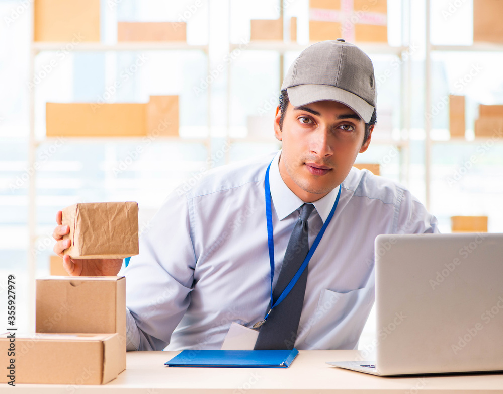 Male employee working in box delivery relocation service Male employee working in box delivery relocation service