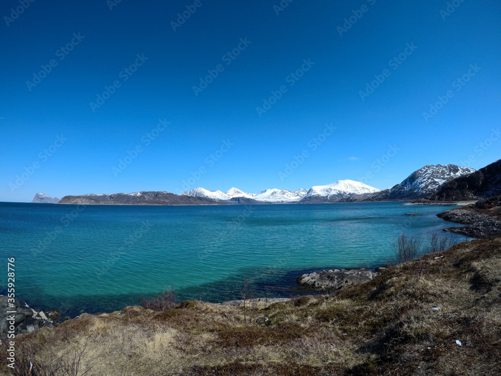 beautiful sea and mountain landscape in northern norway in early spring