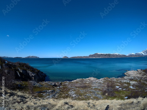 beautiful sea and mountain landscape in northern norway in early spring