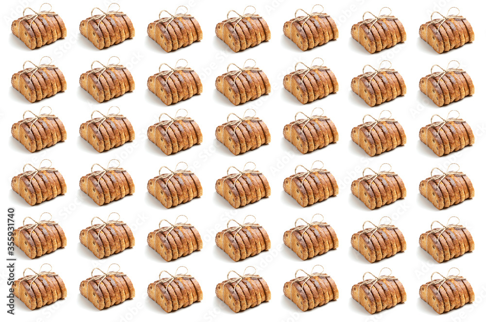 Seamless pattern from a rusks of crackers on a white background. The concept for culinary design. Seamless pattern from a rusks of crackers on a white background. The concept for culinary design.