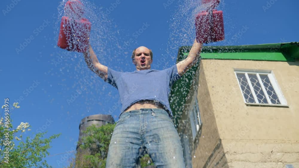 bald mustachioed man joyfully watering the garden with red watering can