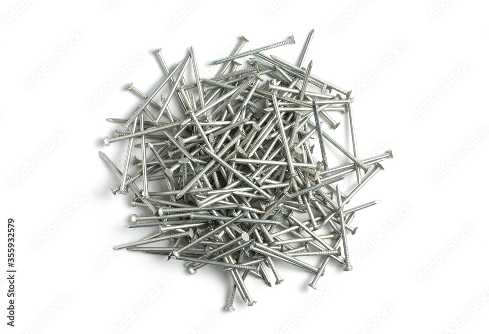 A pile of metal nails on a white background. An isolated object. Concept for construction and repair design.