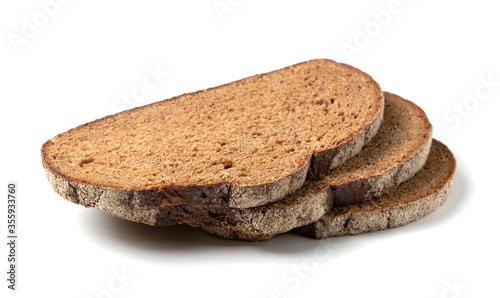 Slices of black rye bread on a white background. Isolated object, a concept for culinary design.