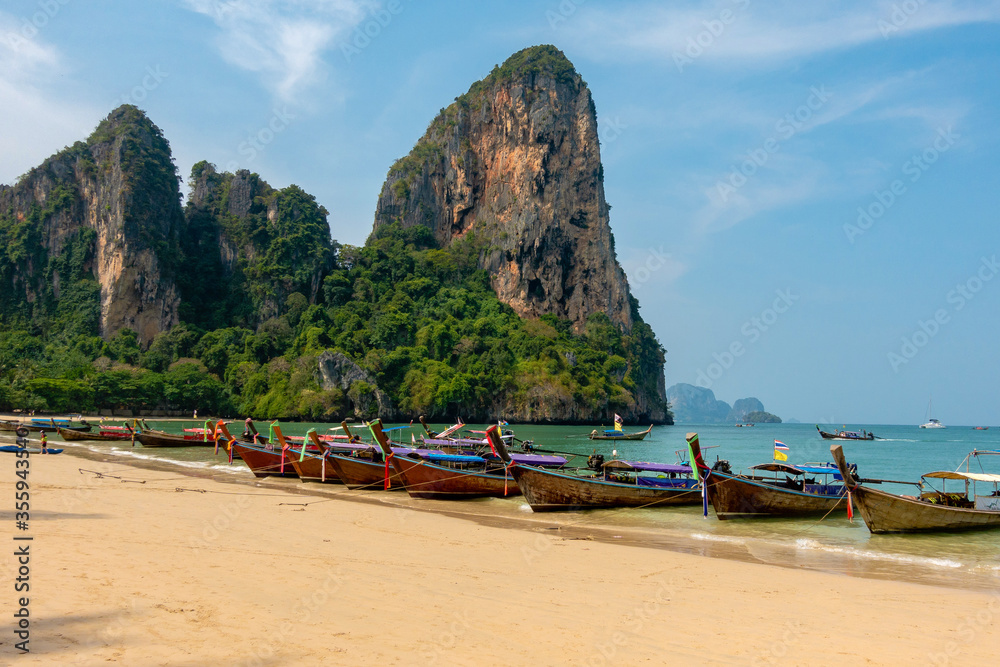 Fototapeta premium Thai traditional longtaile boats at Reilly beach in Krabi province.