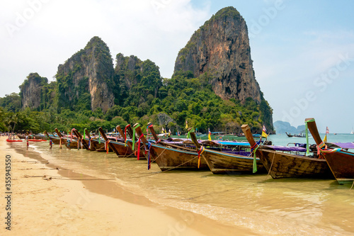 Thai traditional longtaile boats at Reilly beach in Krabi province.