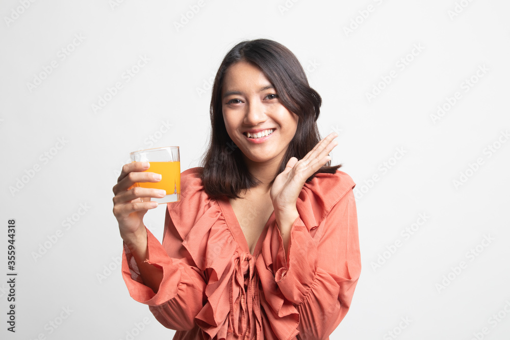 Happy Young Asian woman drink orange juice . Happy Young Asian woman drink orange juice .