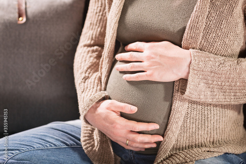 Closeup Shot of a Woman Expecting a Baby Relaxing at Home