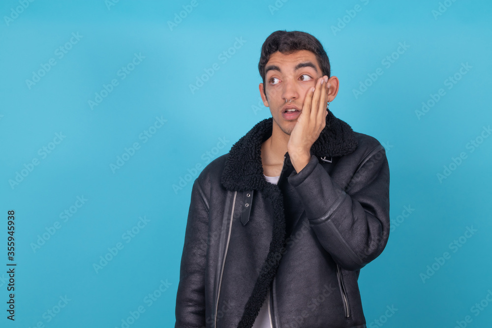 trendy young man isolated on hispanic latin american race color background