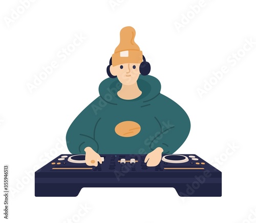 Hipster male disc jockey in hat and headphones mixing music on controller vector flat illustration. Smiling cute DJ playing electronic sound on console isolated on white. Funny stylish guy at party