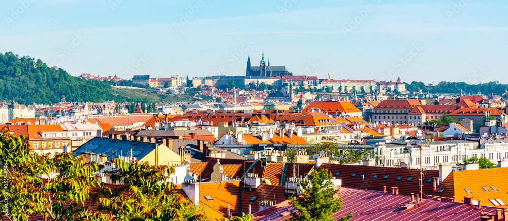 View of Prague Castle from Vysehrad with lush green spring trees, Prague, Czech Republic