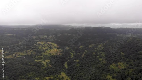 Aerial drone view of hills with farms in rain, Maharashtra, India. photo