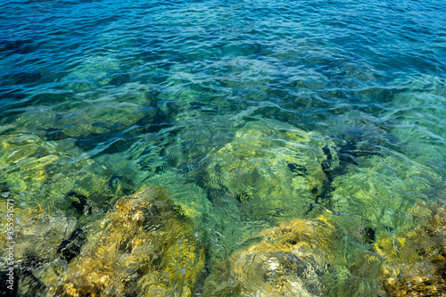 Fototapeta Naklejka Na Ścianę i Meble -  Clean and clear sea water. Paradise rocky shore.