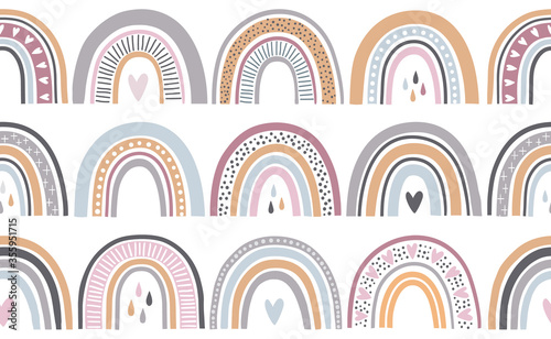 Seamless repeat pattern in pastel colors with rainbows in in scandinavian style. 