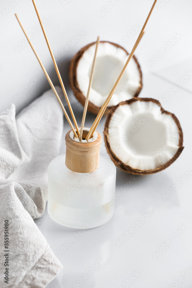 Coconut reed diffuser on table