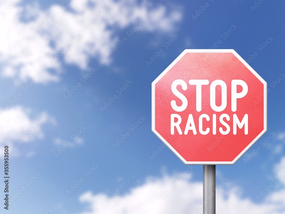 Stop racism - Road sign on blue sky background Stop racism - Road sign on blue sky background