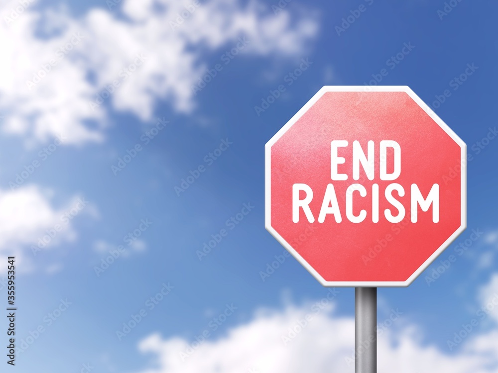 End racism - Road sign on blue sky background End racism - Road sign on blue sky background