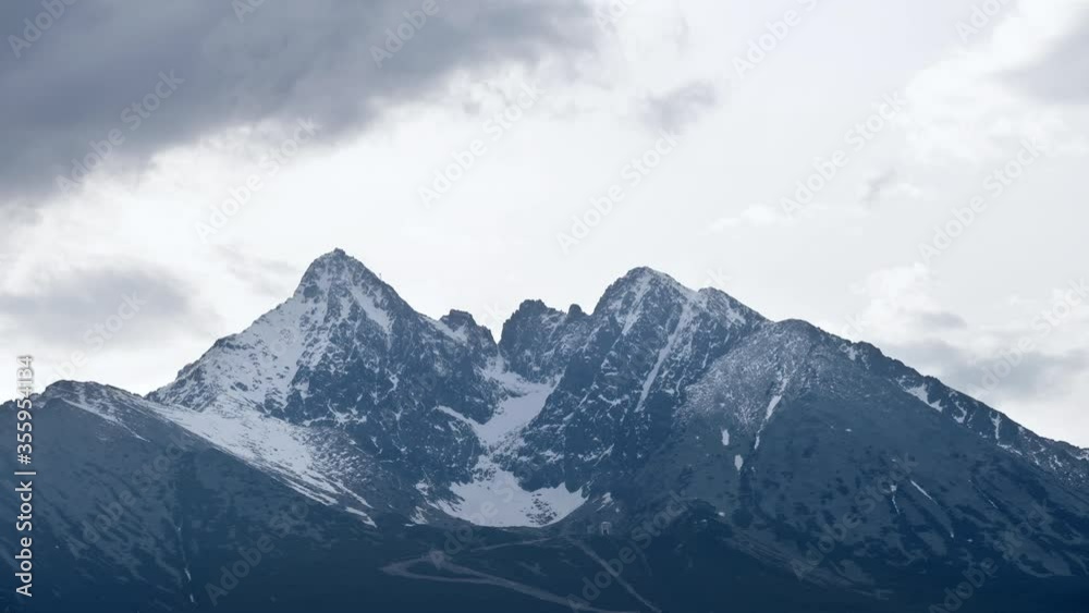 Dramatic sky with heavy clouds Timelapse 4K video over the Lomnicky siit (peak) is the third highest mountain peak in the High Tatra mountains in Slovakia. Dramatic sky with heavy clouds Timelapse 4K video over the Lomnicky siit (peak) is the third highest mountain peak in the High Tatra mountains in Slovakia.