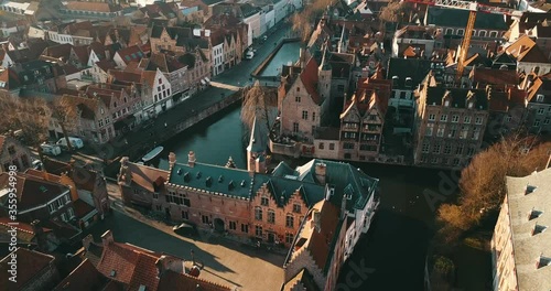 Brugge, Belgium - February 28, 2020: 4K Aerial Footage under the Medieval City Center of Brugge in the Summer Day photo